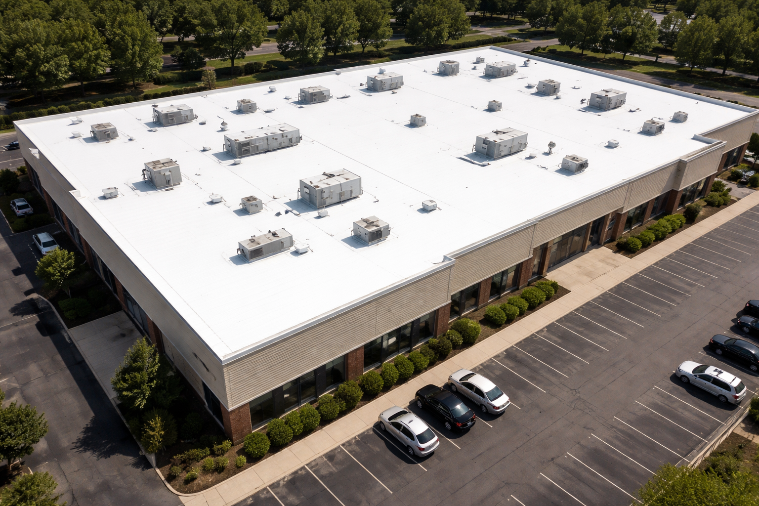 Aerial Commercial Building with White Roof and Parking Lot-1