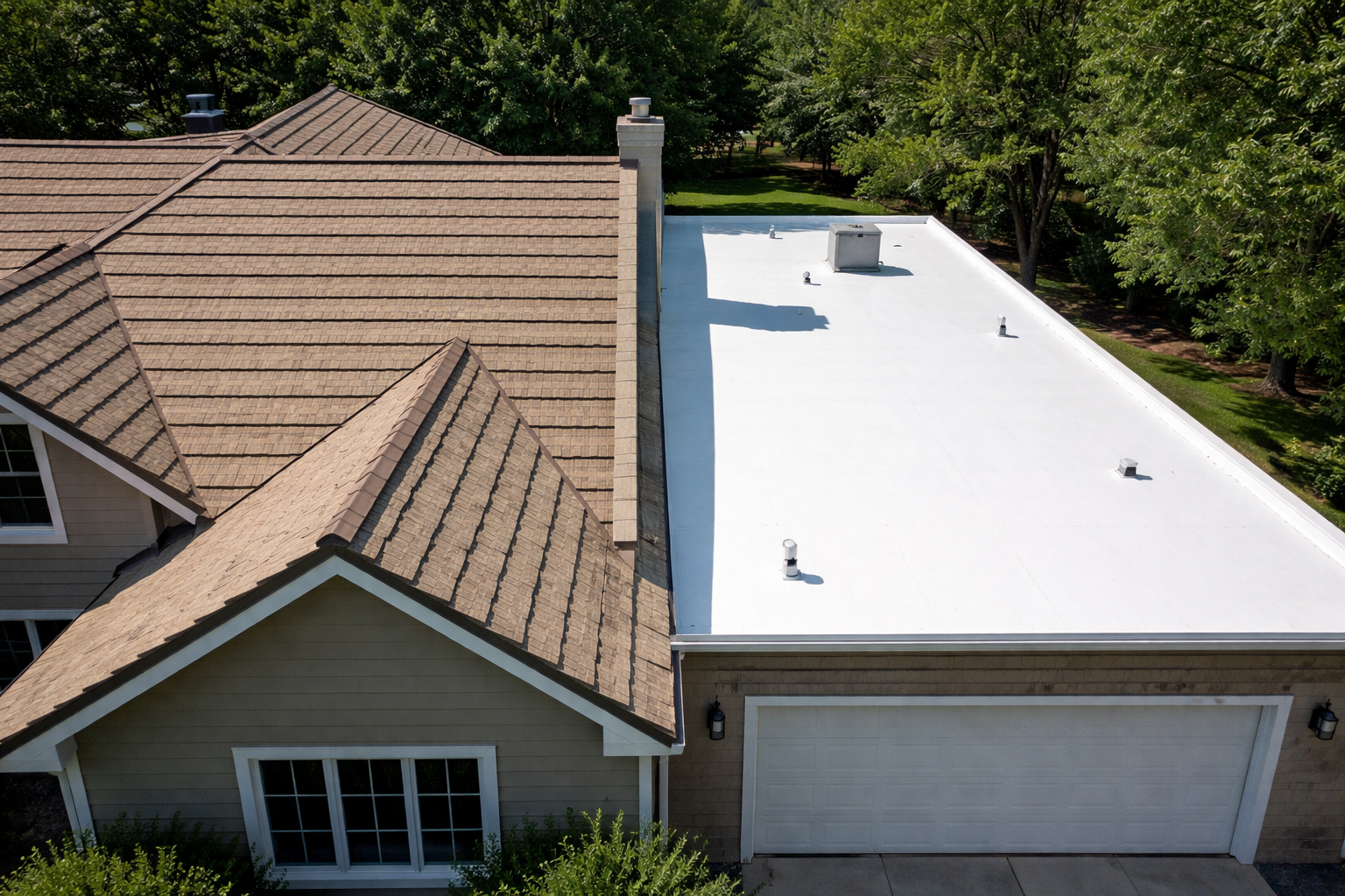 Split Roof View of Residential Home with Stone and TPO Sections