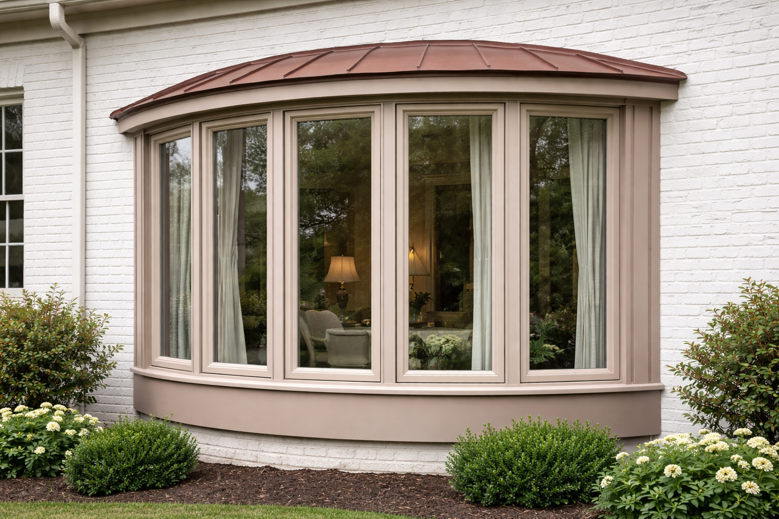photographic Bow  Clay frameExterior photograph of a clay colored vinyl bow window curving gently outward from a home with white painted brick four eq